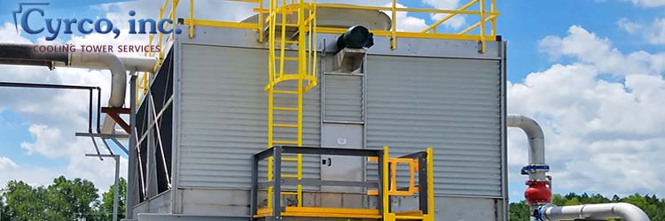 Custom Manfactured Factory Assembled FAP Cooling Tower with FRP Wall Paneling, FRP Ladder System, Walkway Landing Platforms, Hand Railing, Self Closing Safety Swing Gate, All High Visibility Yellow and OSHA Compliant.