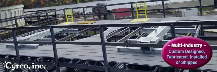 FRP Ladder System through Hatchway Door in FRP Fan Decking on a New FRP Framed Field Erected Cooling Tower. Two New Steel Mechanical Equipment Supports for Mounting Fan Gearboxes and Motors.